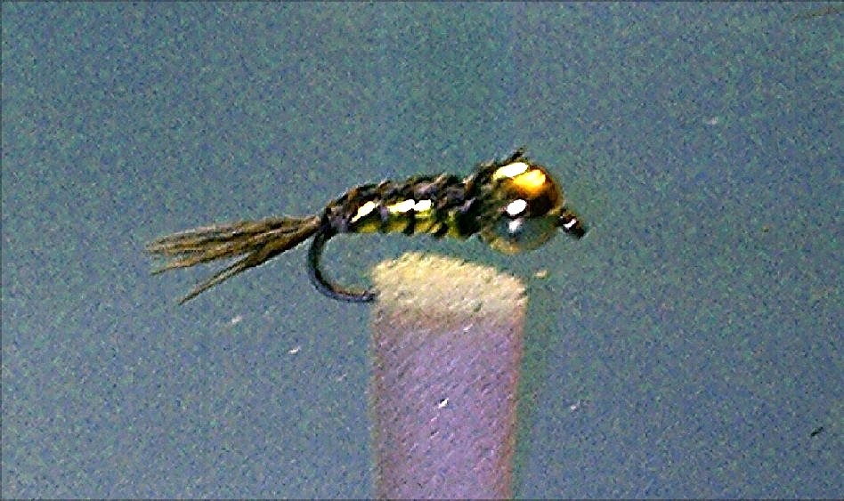 und hier noch eine meiner ersten gebundenen Nymphe.Die aufnahmen sind nicht perfekt aber man kanns erkennen was es da  stellt!Für Kritik habe ich gute Nerven!!!